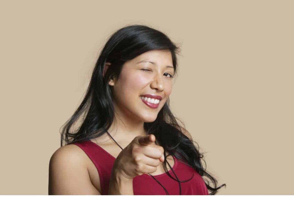 mid 30's woman pointing and smiling
