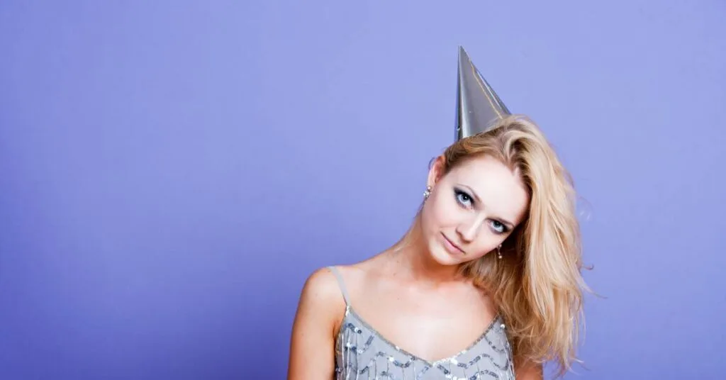 young woman with party hat