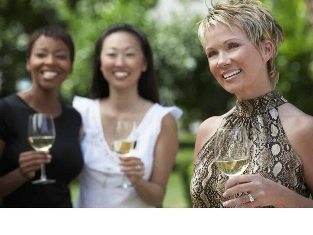 middle aged women celebrating with champagne