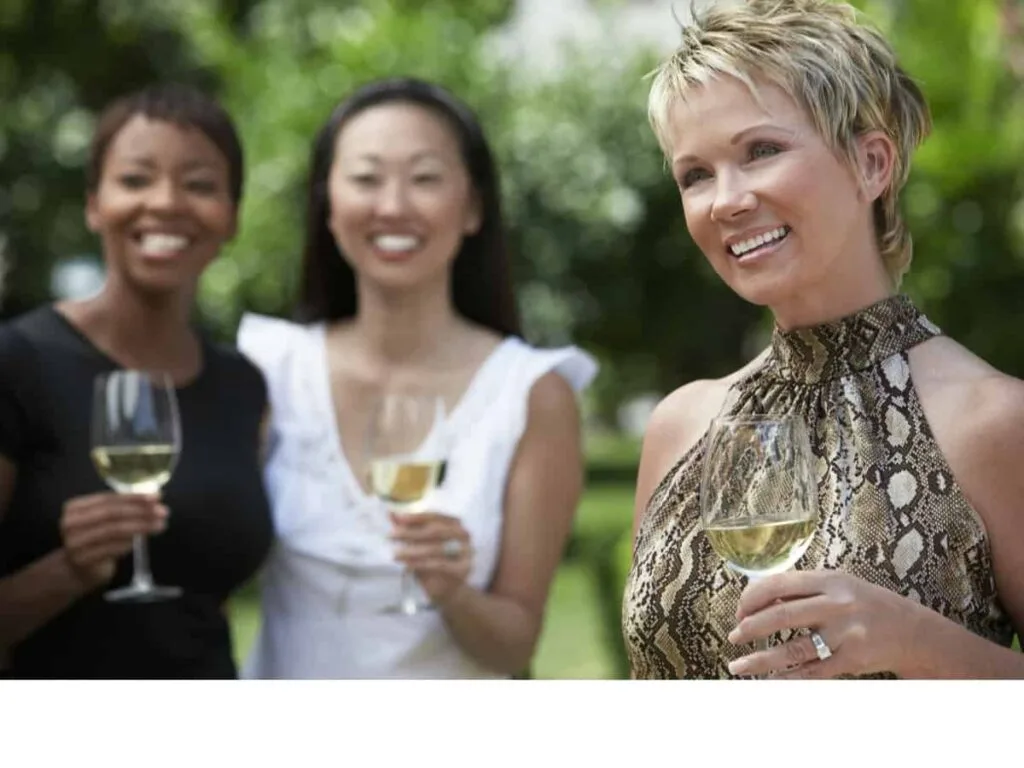 middle aged women celebrating with champagne
