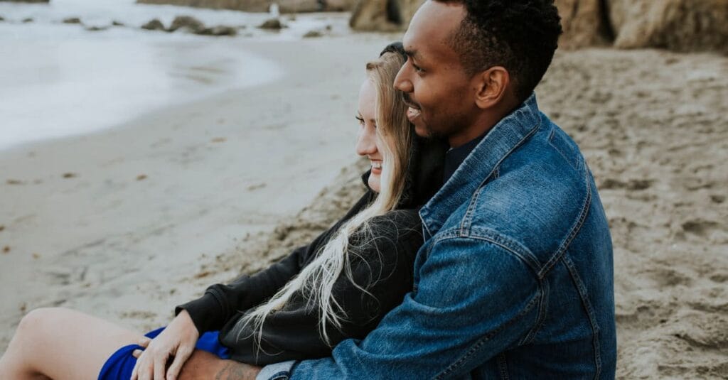 couple-relaxing-near-the-water