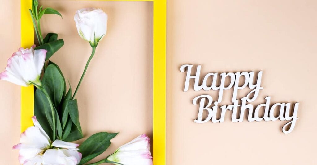 spring flowers and happy birthday signage