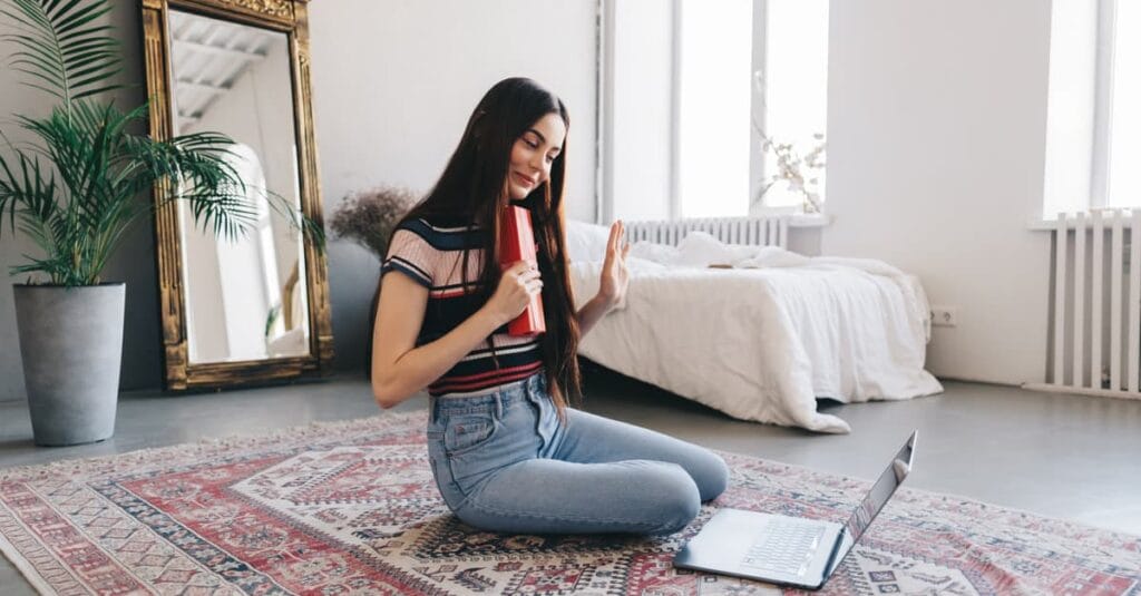 young-woman-celebrating-a-long-distance-birthday-on-her-laptop